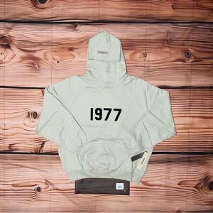 Essentials Gray Hoodie with Black '1977' Design